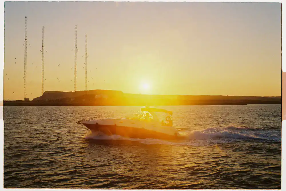 Boat cruising through coastal waters